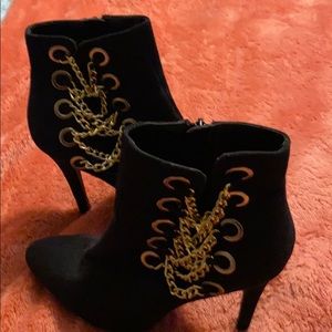 Black sued and gold Chan booties